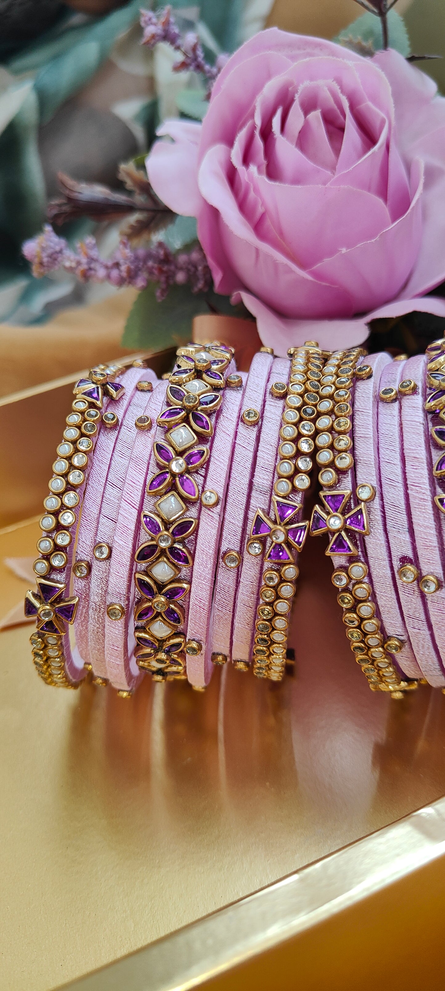 Elegant Pink Silk Thread Bangles Set with Gold-Plated Floral and Stonework Design