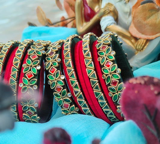 Royal Red and Black Silk Thread Bangles Set with Gold-Plated Green and Red Stone Floral Design